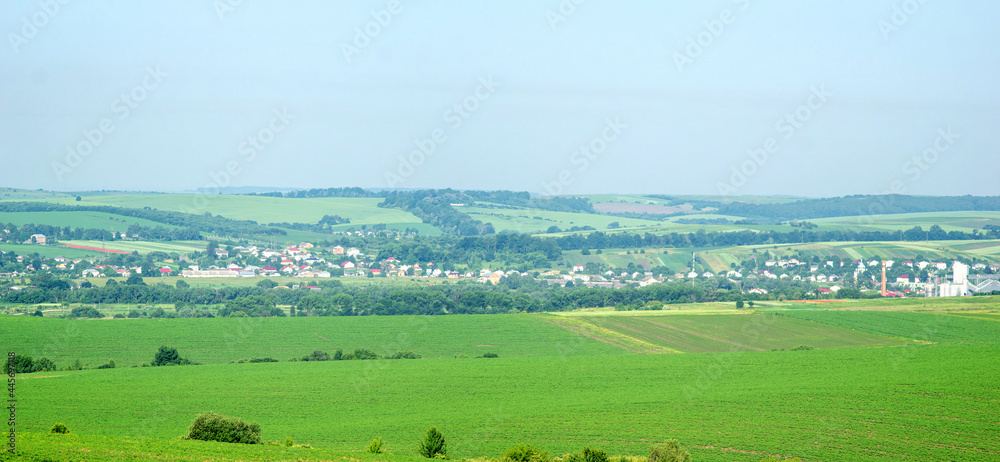 Small town Rohatyn in Ukraine among fields and hills on a summer day