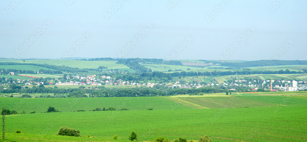 Obraz premium Small town Rohatyn in Ukraine among fields and hills on a summer day