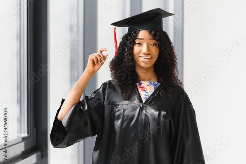 beautiful african female student with graduation certificate