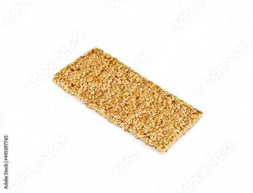 Sesame brittle bar on white background.