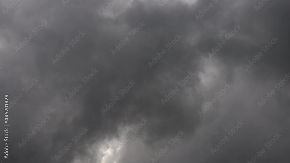 Abstract dark clouds or smoke background in slow motion. Gray clouds on rainy weather.