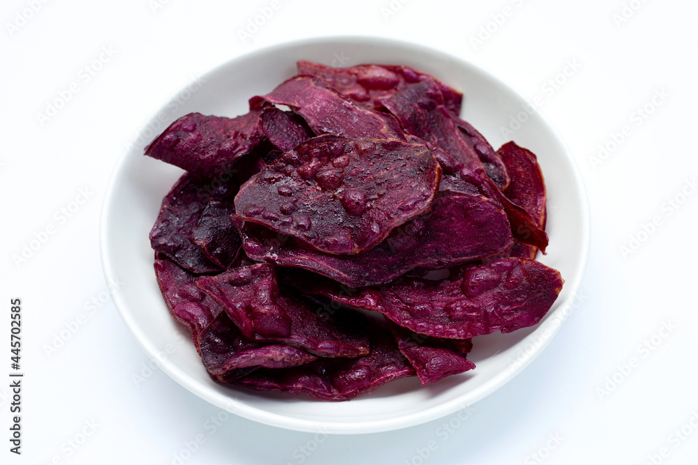 Fototapeta premium Purple sweet potato chips on white
