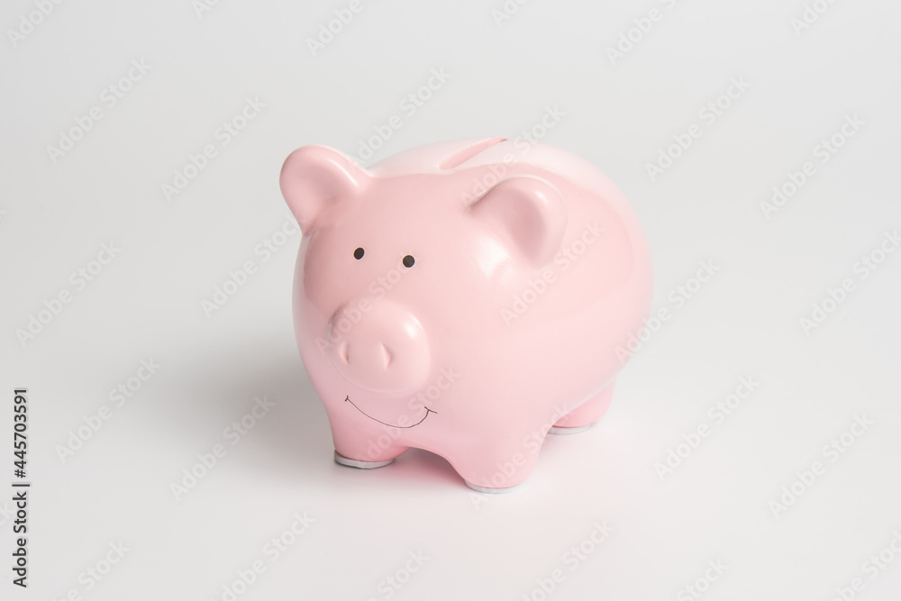 Pink piggy bank on a white background