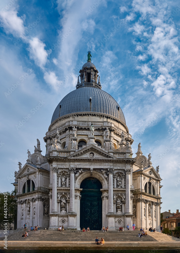 Beautiful view of iconic basilica di Santa Maria della Salute or St Mary of Health by waterfront of Grand Canal, Venice, Italy.