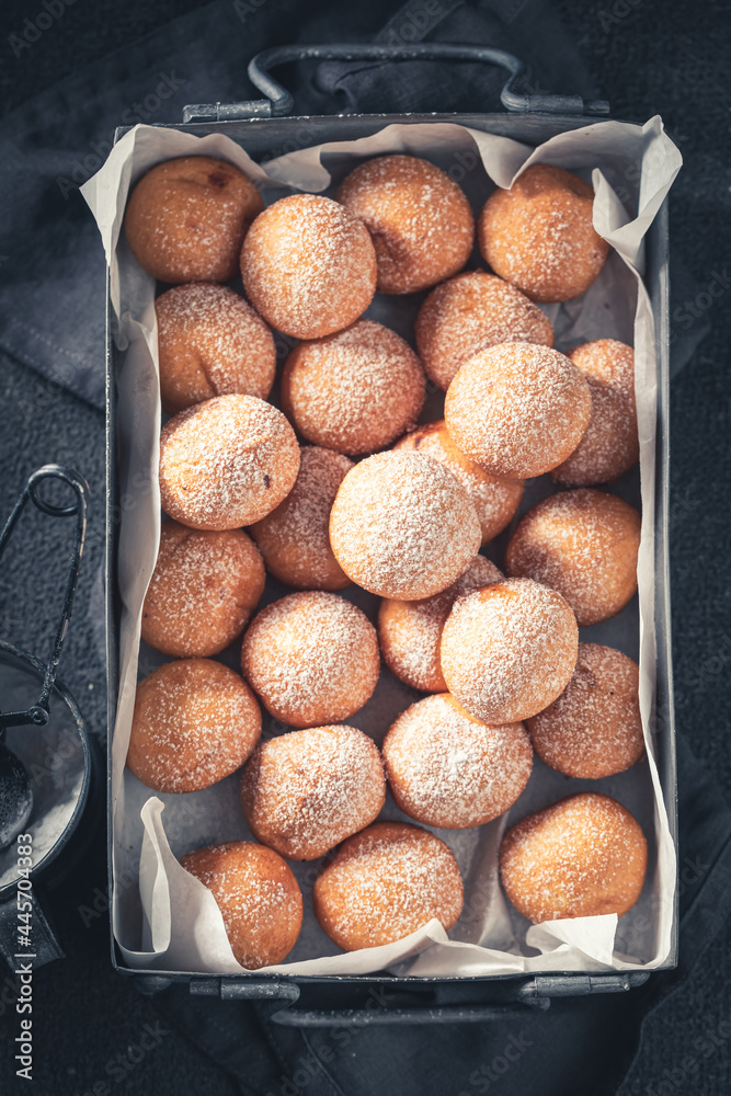 Homemade donut balls with powdered sugar. Donuts baked at home. Homemade donut balls with powdered sugar. Donuts baked at home.