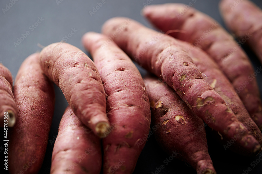 fresh sweet potato on black background fresh sweet potato on black background