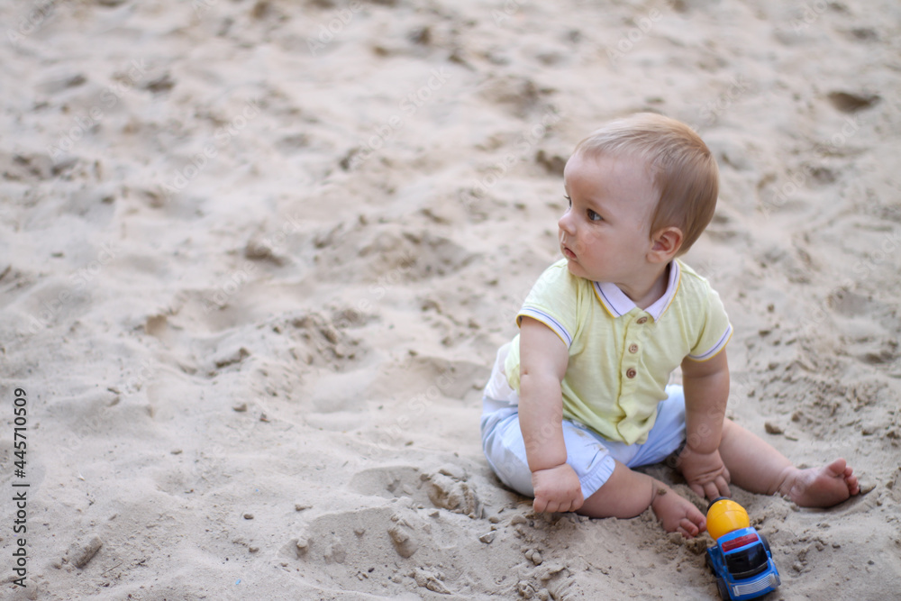 little boy playing in the sand. baby plays with sand. Summer rest. Sun, sea, beach, sand. Rest, childhood. little boy playing in the sand. baby plays with sand. Summer rest. Sun, sea, beach, sand. Rest, childhood.