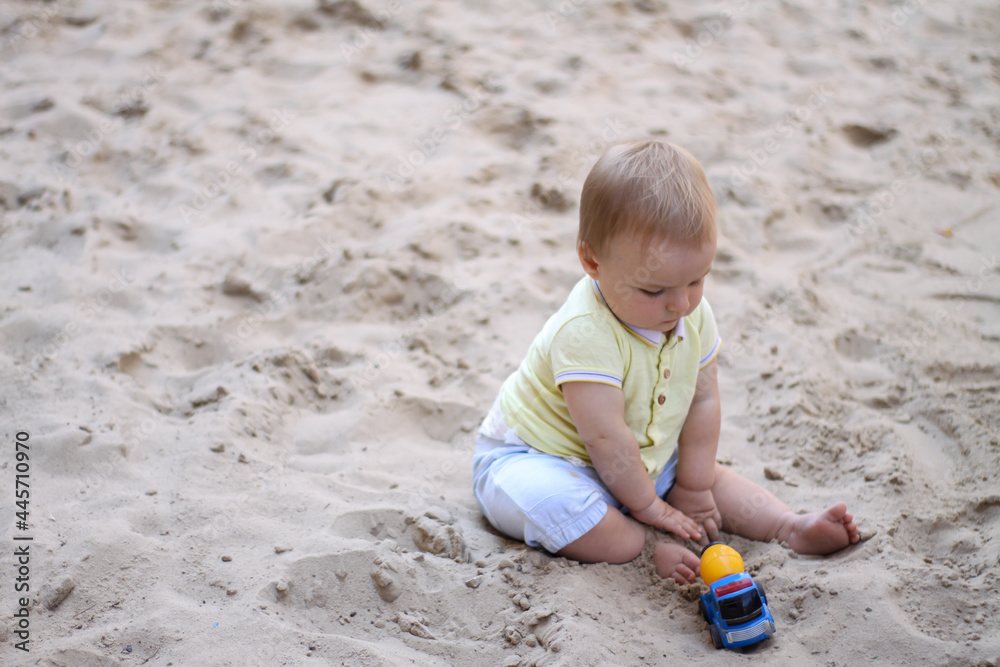 little boy playing in the sand. baby plays with sand. Summer rest. Sun, sea, beach, sand. Rest, childhood. little boy playing in the sand. baby plays with sand. Summer rest. Sun, sea, beach, sand. Rest, childhood.