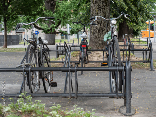 Three Old Bicycles Padlocked to the Rack