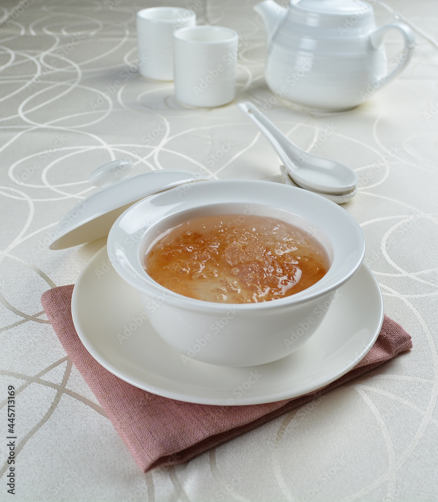 luxury chilled sweet fresh bird nest soup with almond paste and peach resin in bowl and pink table cloth halal healthy dessert menu luxury chilled sweet fresh bird nest soup with almond paste and peach resin in bowl and pink table cloth halal healthy dessert menu