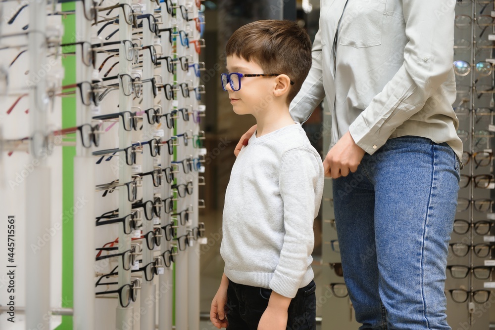 Mother with cute son. Family buy glasses Mother with cute son. Family buy glasses