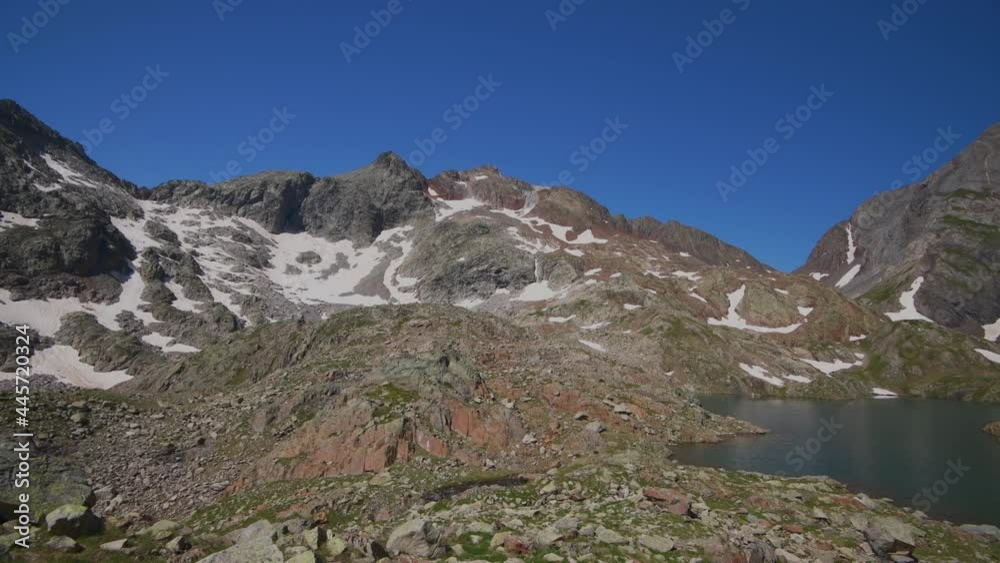 One of the Azul Lakes with Piedrafita peak and Infierno peak, Pyrenees, Tena Valley, Huesca Province, Aragon, Spain One of the Azul Lakes with Piedrafita peak and Infierno peak, Pyrenees, Tena Valley, Huesca Province, Aragon, Spain