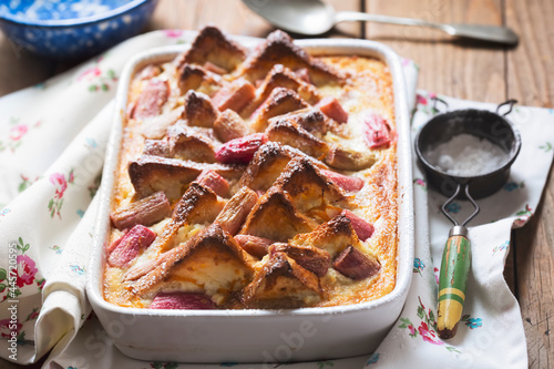 Rhubarb ricotta bread and butter pudding with icing sugar 