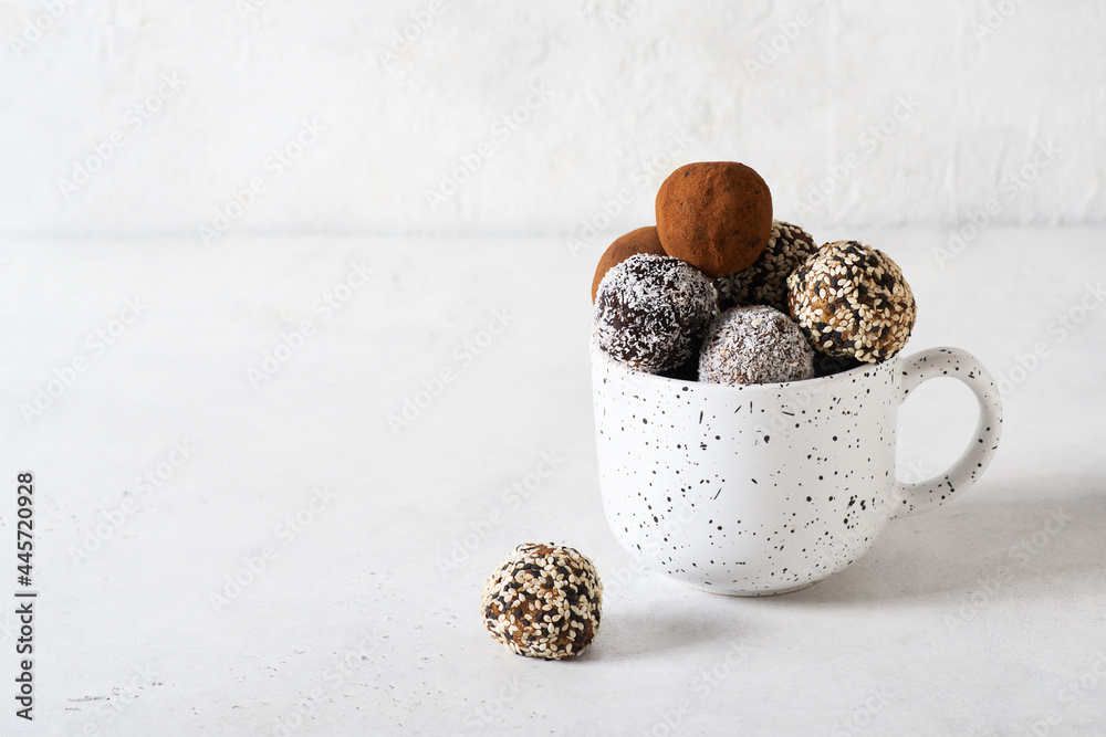 Carob energy balls with nuts, dates and coconut, vegan and vegetarian sweet  food Stock Photo | Adobe Stock
