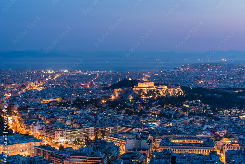 Aerial view of Athens city and Acropolis illuminated after sunset, Greece