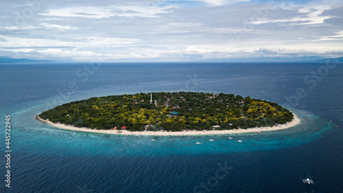 Scenic Aerial Drone Panorama Picture of A White Sand Beach with Bangka Boats in Balicasag Island in Panglao, Bohol, Philippines photo