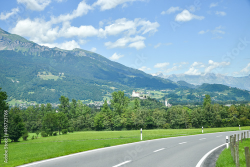 country road through the Principality of Liechtenstein  view to Balzers village and fortress Gutenberg