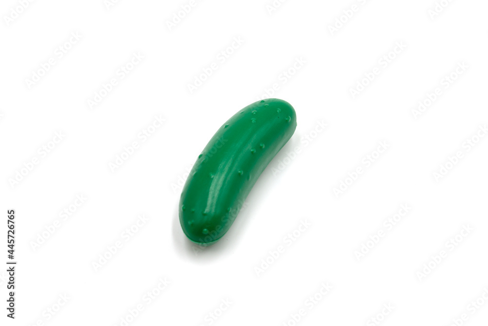 Isolated photo of a plastic cucumber toy Isolated photo of a plastic cucumber toy