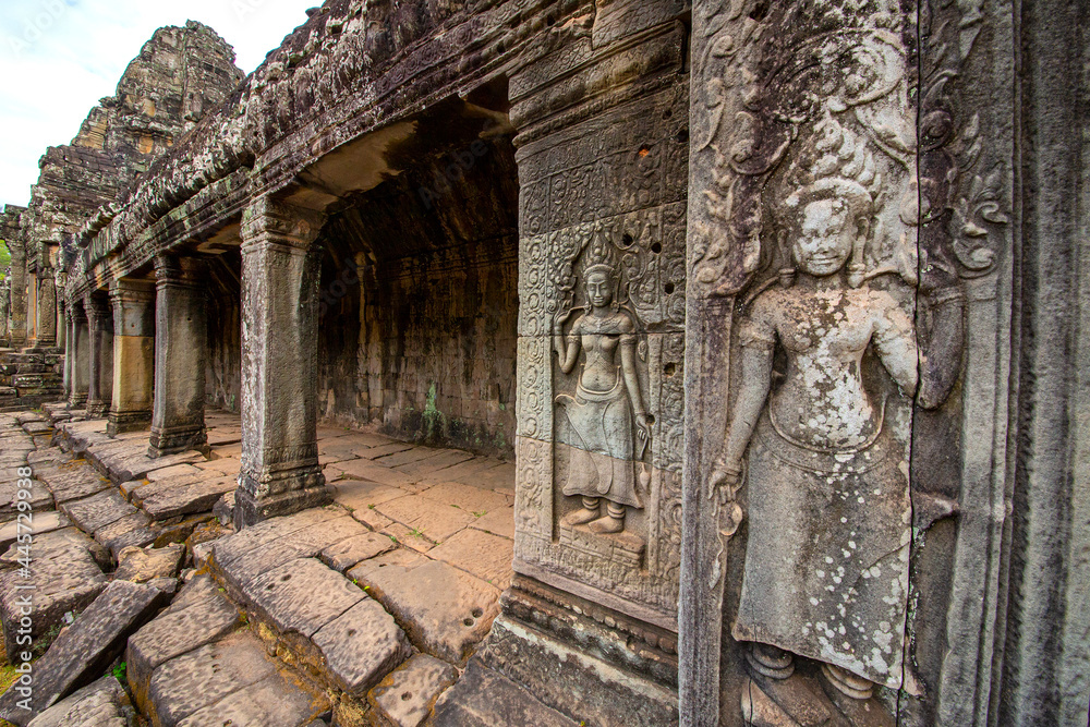Naklejka premium The low relief carvings surrounding Bayon Castle belong to the Khmer Empire. Located in the center of Angkor Thom