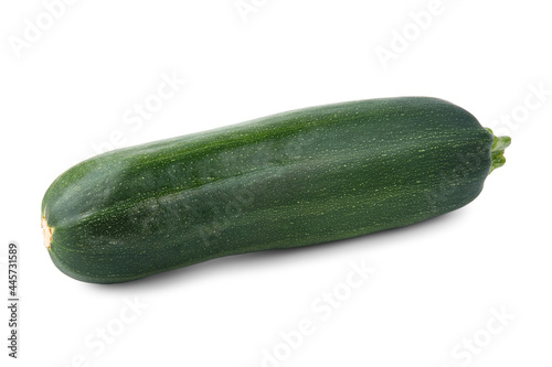 An oblong and large green vegetable marrow (zucchini) is isolated on a white background with soft shadows.