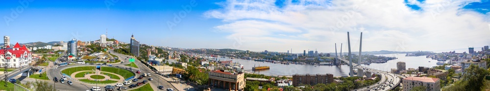 Russian city Vladivostok panoramic view on Golden Bridge and harbor