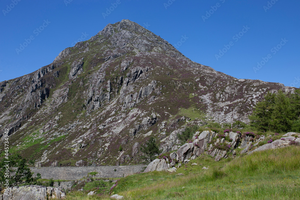 Pen Yr Ole Wen mountain with the A5 road in the Snowdonia National Park, North Wales. On a summers day with blue sky