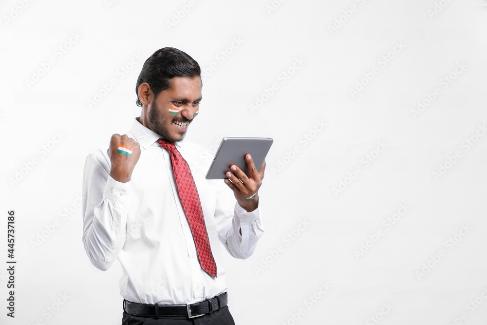 Young indian businessman or employee using smartphone. Young indian businessman or employee using smartphone.
