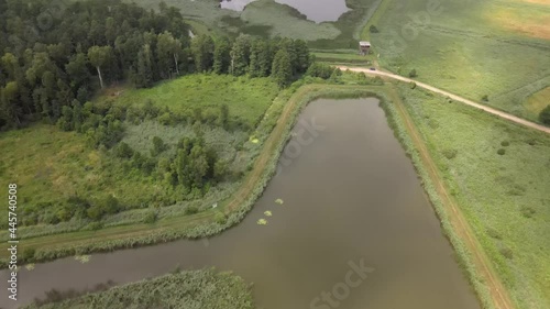 Top view of former fish ponds overgrown with rushes.These lagoons are used by birds such as herons and rushes during the breeding seanson. photo