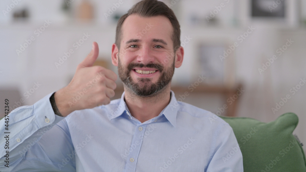 Young Man with Thumbs Up at Home Young Man with Thumbs Up at Home