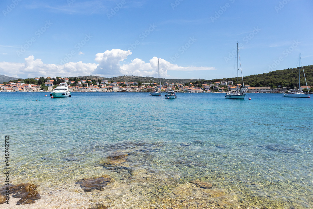 Sailing boats anchored in the wonderful, shallow, turquoise bay of Rogoznica, Croatia, popular tourist and nautical destination