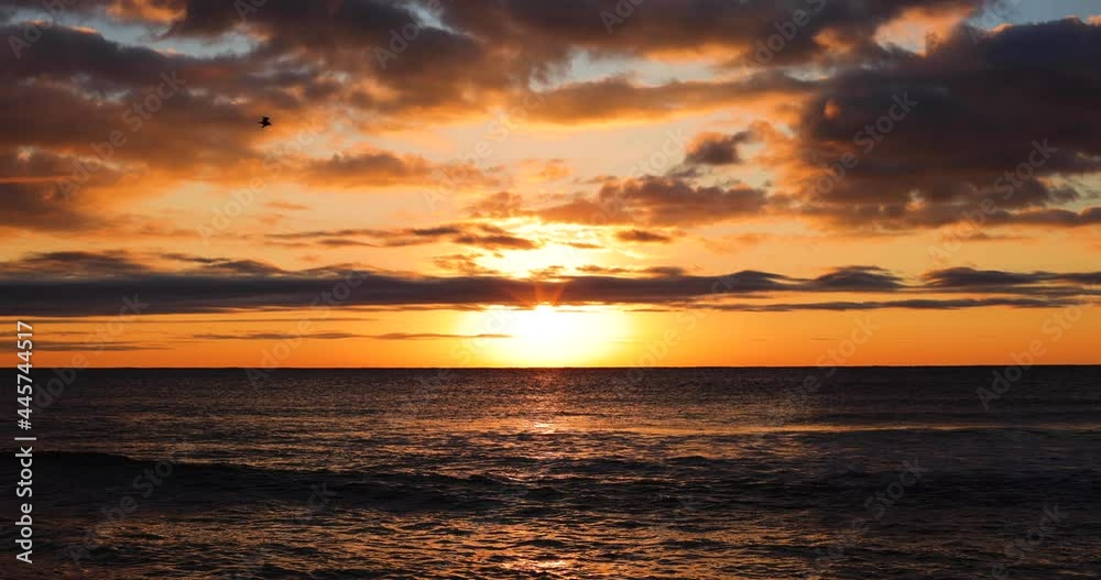 Tropical sunrise over the ocean.Sun rising over the sea waves.