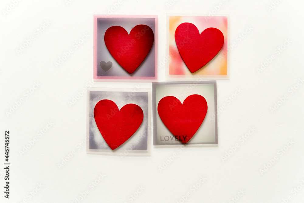 four themed photo overlays with hand-painted wooden hearts on a light background with plenty of space for copy or text