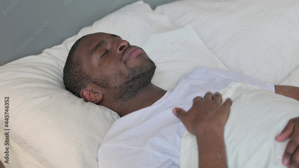 Peaceful Young African Man Sleeping in Bed Peaceful Young African Man Sleeping in Bed