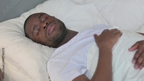 Relaxed Young African Man Sleeping in Bed 