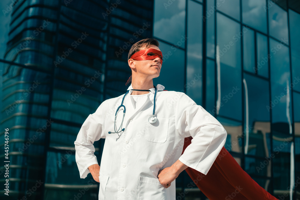 close up. confident young doctor in a superhero Cape.
