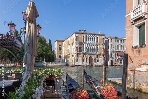 Venezia. Gondole in sosta vicino all' Accademia sul Canal Grande sullo sfondo di Palazzo Franchetti Cavalli. photo