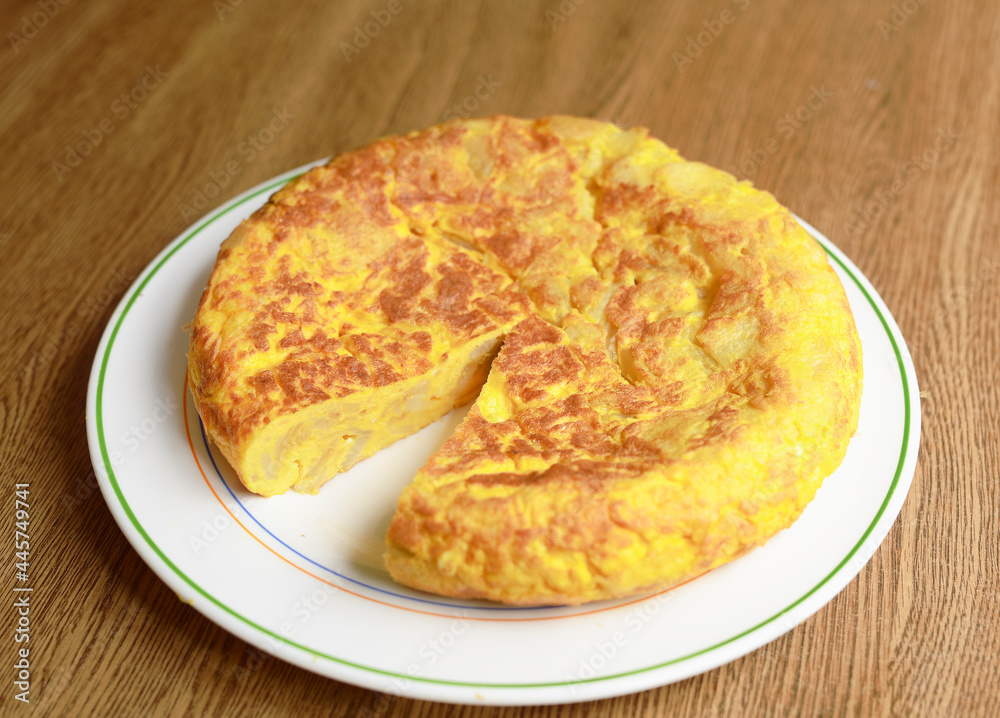 Homemade Spanish omelette on a white plate.