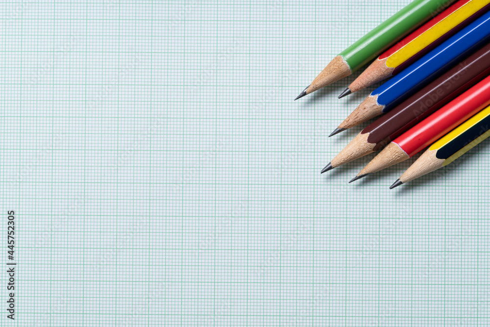 pencils on green graph paper, study research science and education concept pencils on green graph paper, study research science and education concept