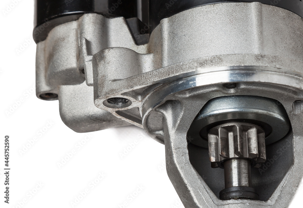 Starter of an internal combustion engine New Spare part for car on a white background. Spare parts catalog Starter of an internal combustion engine New Spare part for car on a white background. Spare parts catalog