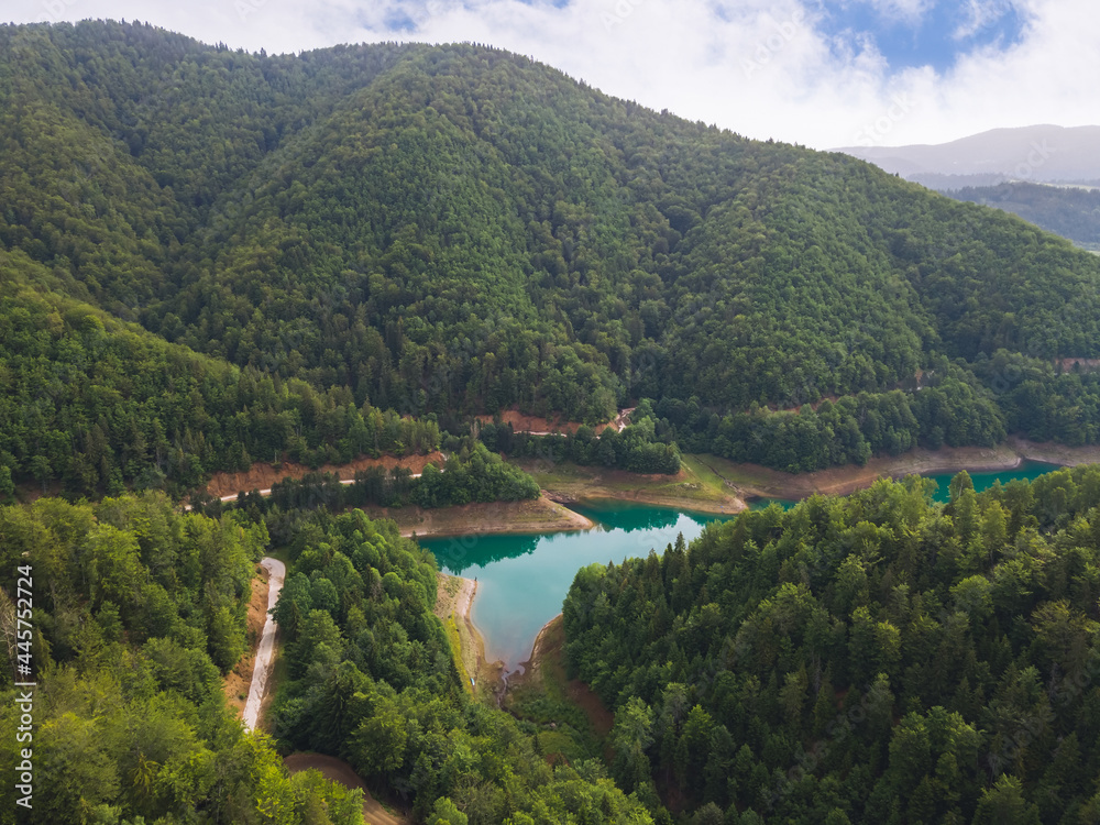 Mountain lake. Turquoise lake surrounded by mountains. Nature outdoors travel destination, National park Tara, Zaovine lake, Serbia