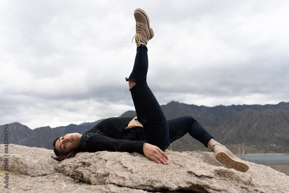 Dancer on the cloudy mountain with her leg raised Dancer on the cloudy mountain with her leg raised