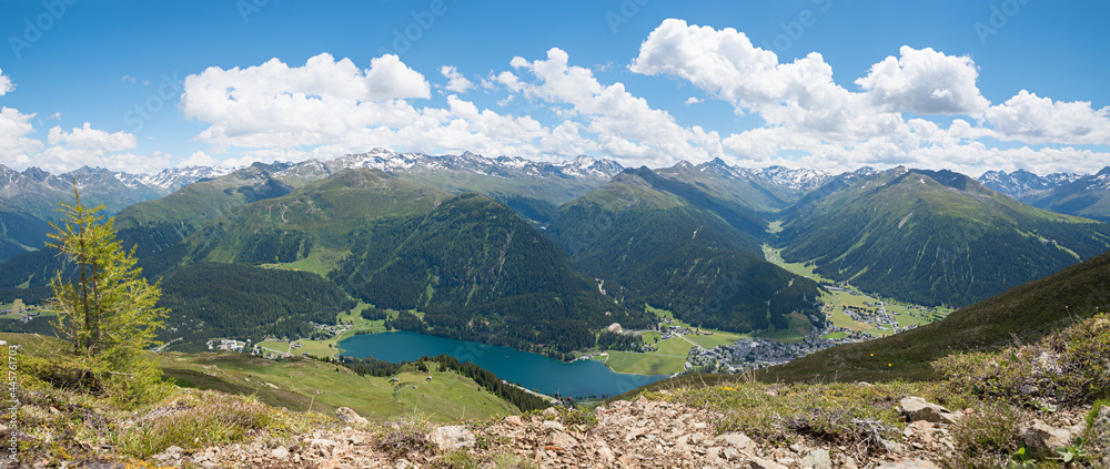 stunning lookout from Parsenn ridgeway to lake and tourist resort Davos, swiss alps