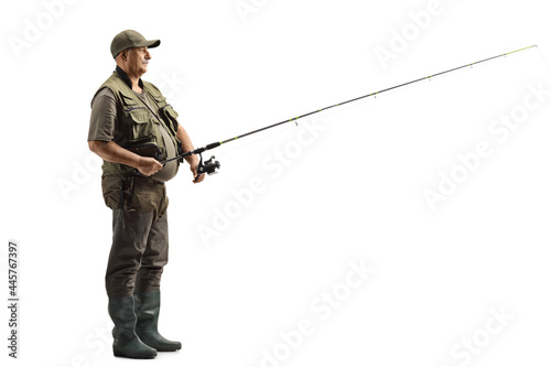 Full length profile shot of a fisherman with a fishing rod