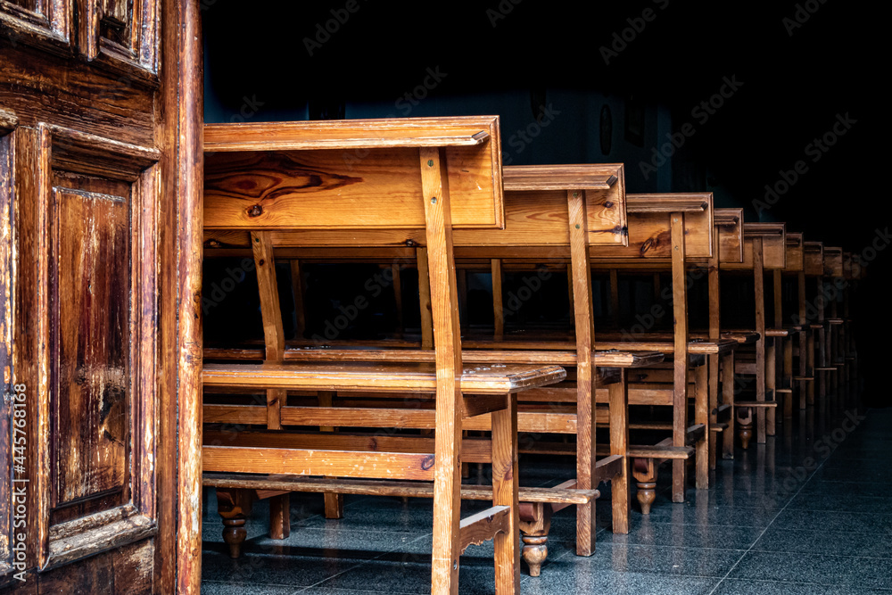 A row of wooden church benches A row of wooden church benches