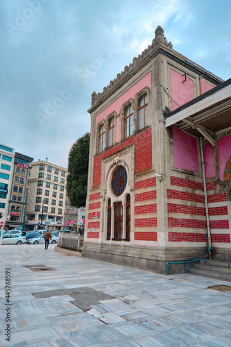Facade of sirkeci train station with ottoman empire patterns 03.03.2021 istanbul Turkey. Corner of the Sirkeci main train station of european side of istanbul with city life and moder house background