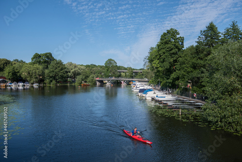 View from the passage Pålsundet in Stockholm with boats, canoe and water lilies photo