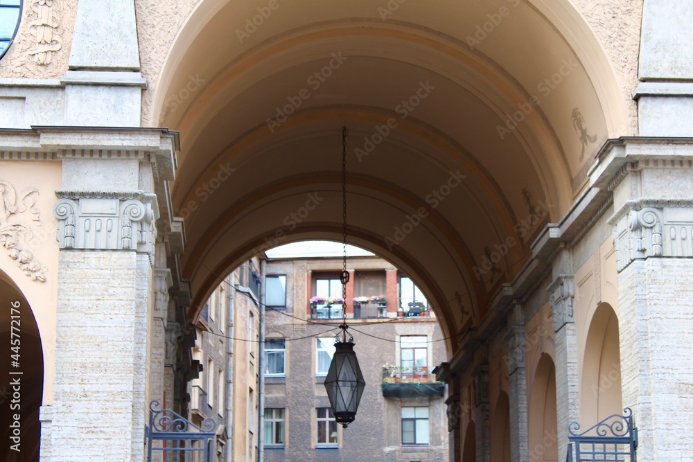 High Renaissance Arches with a hanging lantern of the Tolstoy House located at 15-17 Rubinstein Street and 54 Fontanka Embankment. designed by F. Lidval in National Romantic style