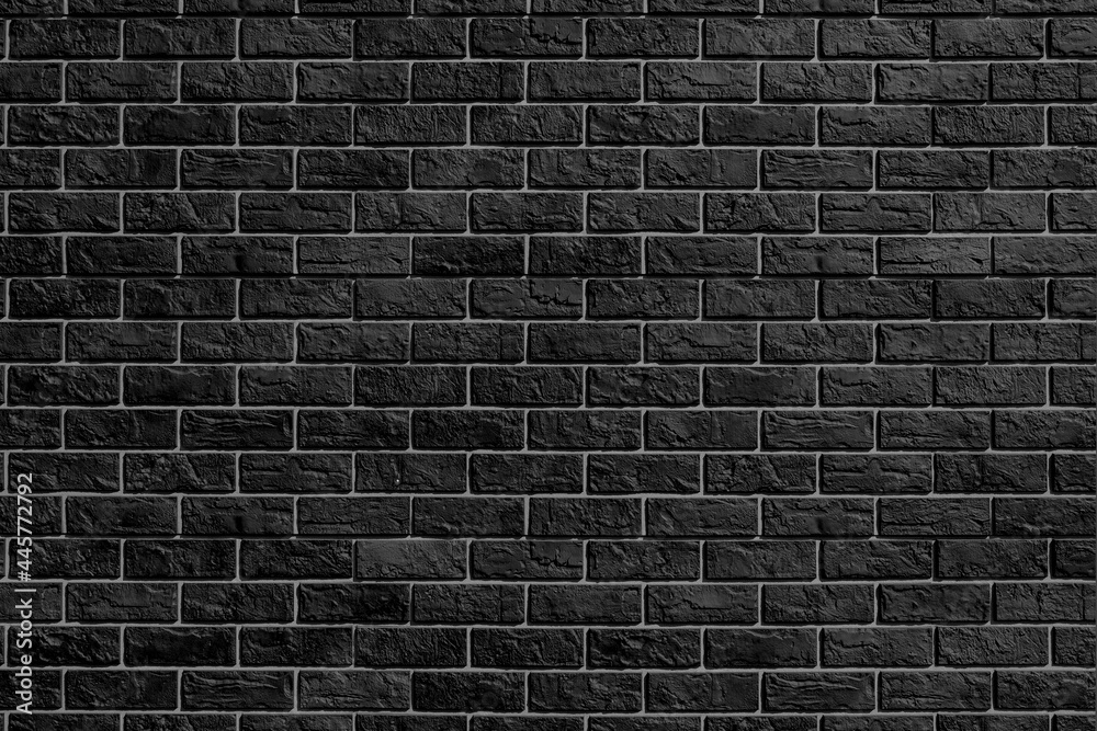 Black brick wall. Modern construction industry. Building's facade.