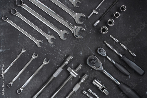 Car repair tools on a dark background. Neat wrench layout