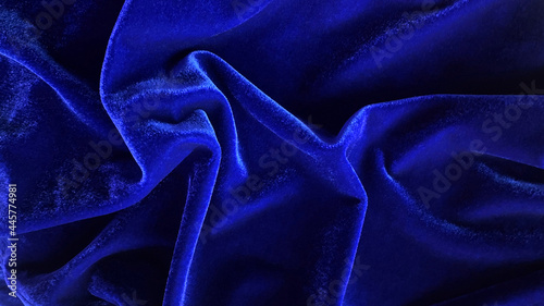 Blue velvet fabric texture used as background. Empty Bluefabric background of soft and smooth textile material. There is space for text. photo